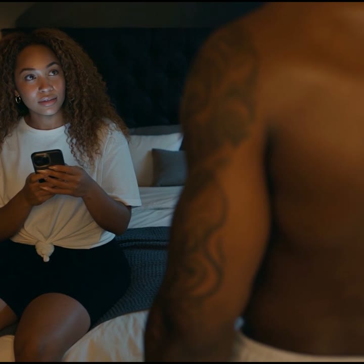 Over his shoulder: Imani looks up at Dre
